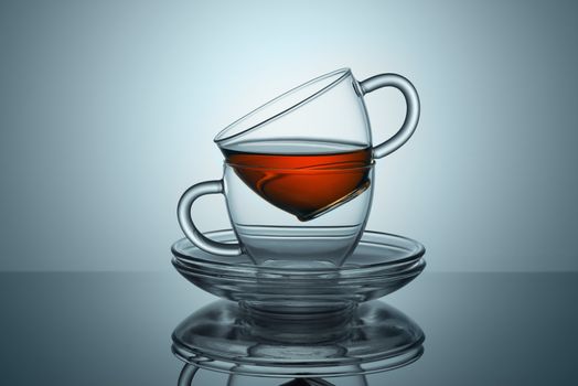 Two cups with saucers from transparent glass from the tea remains