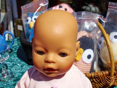 Old vintage antique doll head for sale in a flea market