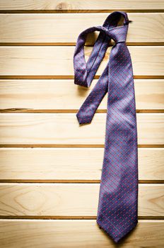 necktie on rustic wood background