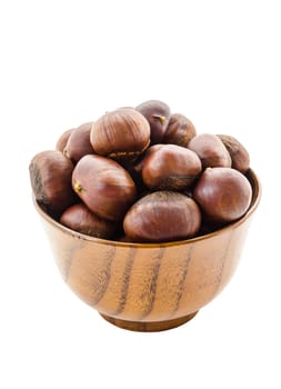 Sweet chestnut in wooden bowl isolated on white background