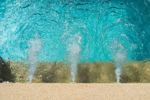 Close-up water running system in swimming pool.