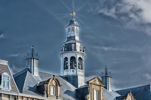 Artistic work of my own. HDR processing.
Old historic church spire against a blue sky.