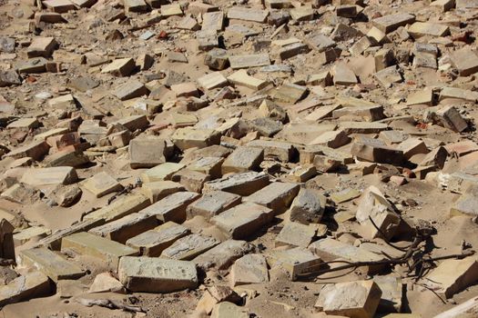 Closeup on Yellow Clay Building Brick Tiles in Sand