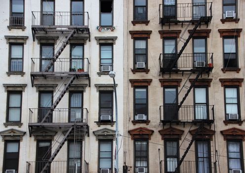 Outdoor Fire Escapes on Two Contrast Apartment Buildings in New York