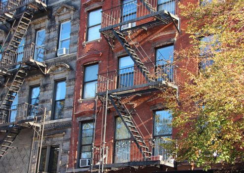 Perspective of Fire Escape Steel Ladders on Apartment Building Block in New York