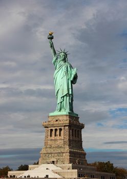 Statue of Liberty with Dark Blue Clouds Vertical Front view