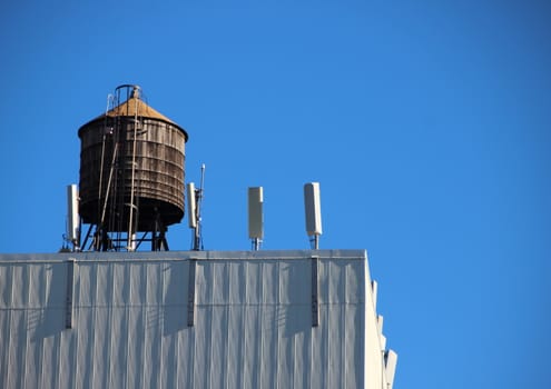 Top Roof Wooden Water Tank Container with Blue Sky