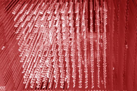 Modern glass chandelier. Decorative red crystal chandelier on the ceiling - interior decoration abstract background. Abstract background texture
