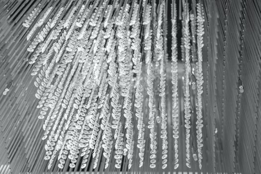 Modern glass chandelier. Decorative silver crystal chandelier on the ceiling - interior decoration abstract background. Abstract background texture