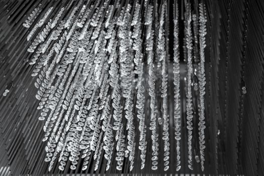 Modern glass chandelier. Decorative black crystal chandelier on the ceiling - interior decoration abstract background. Abstract background texture