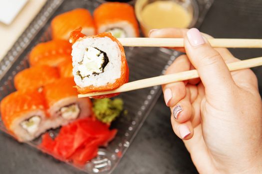 Sushi roll philadelphia. Philadelphia roll in Disposable Plastic Food Container. Business lunch concept