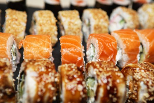Best Types of Sushi Rolls. Philadelphia Roll, California Roll, Eel Avocado Roll. Delicious rolls and sushi with eel, salmon, shrimp, cucumber and philadelphia. Various delicious Types of Sushi Rolls