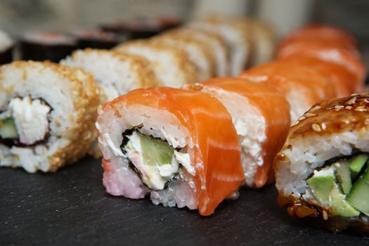 Best Types of Sushi Rolls. Philadelphia Roll, California Roll, Eel Avocado Roll. Delicious rolls and sushi with eel, salmon, shrimp, cucumber and philadelphia. Various delicious Types of Sushi Rolls