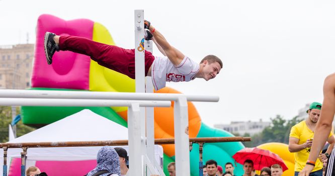 Kharkiv, Ukraine - June 11, 2016: Man performs a trick "Battle Barstylers Workout" on Freedom Square in Kharkov