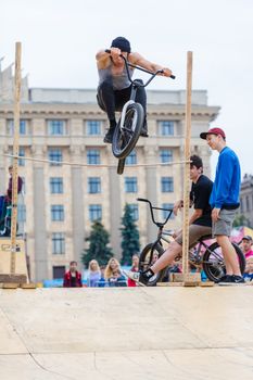 KHARKOV, UKRAINE - JUNE 11, 2016: Young guy is showing extreme jumps on a skate stage