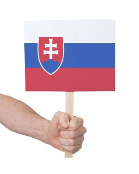 Hand holding small card, isolated on white - Flag of Slovakia