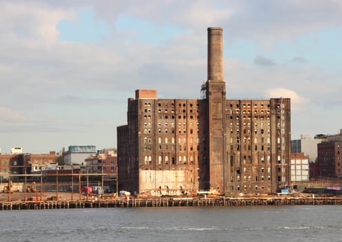 Abandon Old Factory in New York at Pier with East River in Foreground