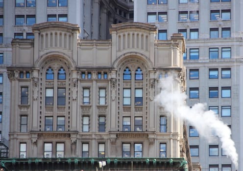 Old Building in New York with Stream and Modern Urban Background