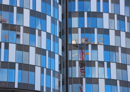 Round Urban Building Abstract with Window Reflection. Apartments are Build around a closed Granary