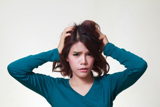 Stress. Woman stressed is going crazy pulling her hair in frustration. 