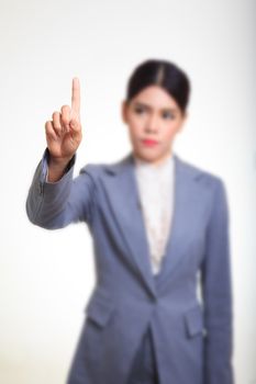 Business woman pointing her finger on imaginery virtual button