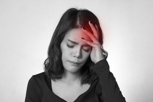 Headache. Young asian woman having a headache