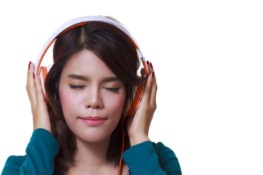 Beautiful young woman with headphones listening to the music