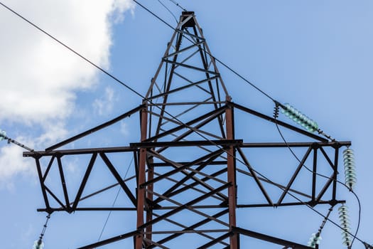 high voltage electric pole on the background of sky