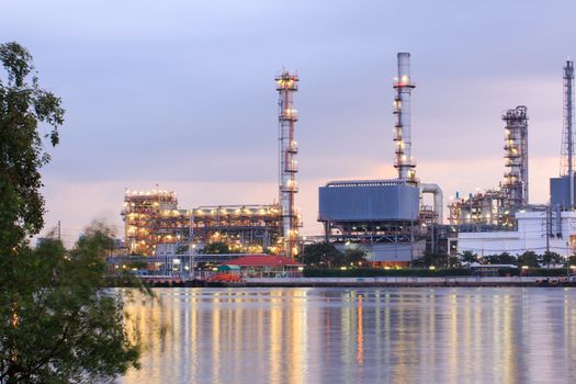 Oil refinery industry plant at dramatic twilight in morning