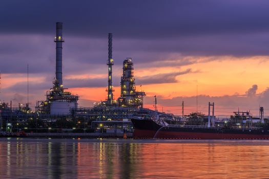 Oil refinery industry plant at dramatic twilight in morning
