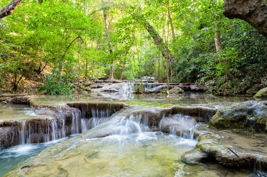 Beautiful waterfall and tropical forests at Erawan National Park is a famous tourist attraction in Kanchanaburi Province, Thailand
