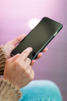 Woman touch on the screen of cellphone