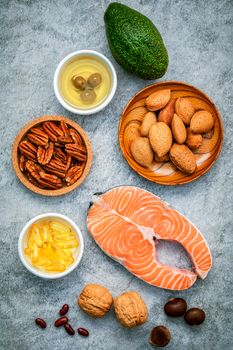 Selection food sources of omega 3 and unsaturated fats. Super food high omega 3 and unsaturated fats for healthy food. Almond ,pecan ,hazelnuts,walnuts ,olive oil ,fish oil ,salmon and avocado .