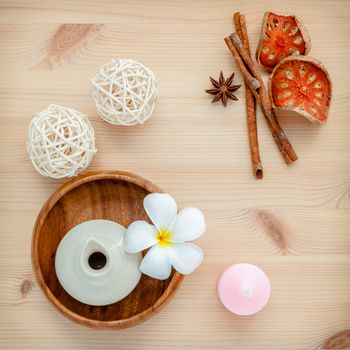 Frangipani tropical flowers with herbal spa products . Plumeria flowers with aromatic oil . Thai spa theme aromatherapy  with herbal. Relaxation with herbal essential oil.