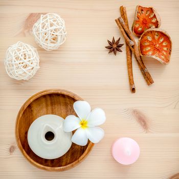 Frangipani tropical flowers with herba spa products . Plumeria flowers with aromatic oil . Thai spa theme aromatherapy  wih herbal. Relaxation with hebal essensial oil.