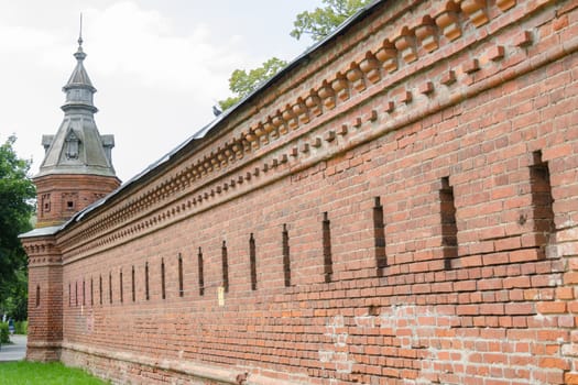 Sergiev Posad - August 10, 2015: Red wall extending from the retail shops around pafnutevskigo garden at Holy Trinity St. Sergius Lavra in Sergiev Posad