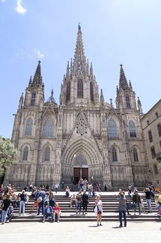 BARCELONA, SPAIN -MAY 11, 2016. Tourists on the square in front of Barcelona Cathedral. It is the Gothic cathedral constructed from the 13th to 15th centuries.
