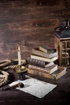 Still life with old objects and bronze candlestick