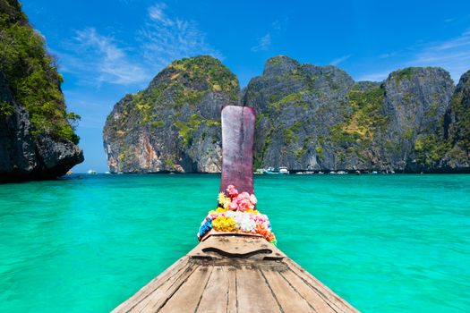 Traditional wooden boat in a picture perfect tropical Maya bay on Koh Phi Phi Leh Island, Thailand, Asia