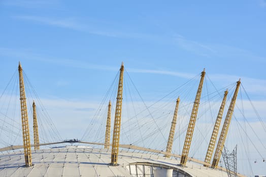 LONDON, UK - DECEMBER 28: Visitors at top of O2 Centre, formerly known as Millennium Dome, in a sunny blue sky day. December 28, 2015 in London.