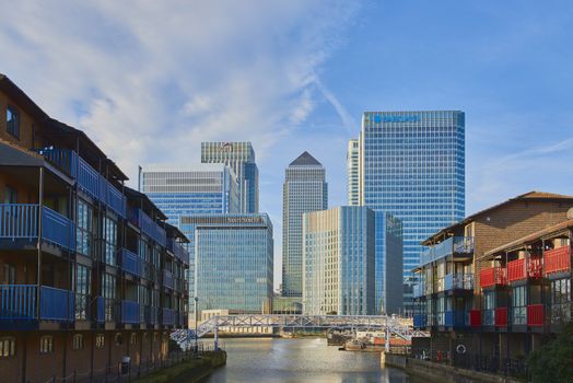 LONDON, UK - DECEMBER 28: Canary Wharf's banks' skyscrapers on sunny blue sky day seen from Blackwall. December 28, 2015 in London.