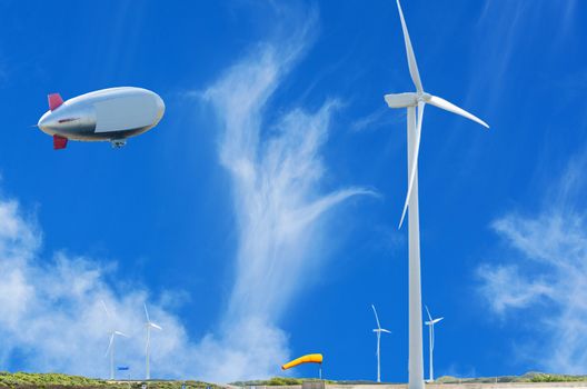 Airship, Zeppelin and wind power plant on the Dutch North Sea coast with blue sky.