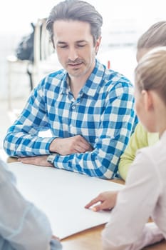 Business team of people in casual talking at meeting table