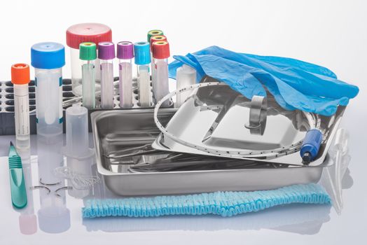 Medical tools in a tray from stainless steel and expendables for clinical laboratory