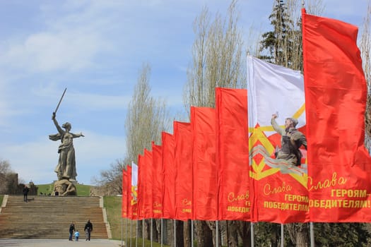 Festive flags with an inscription "Glory to conquering heroes!" on Mamayev Kurgan in Volgograd