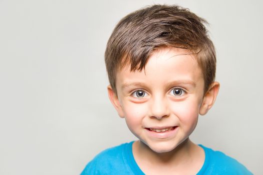 Child in joy smilling at camera