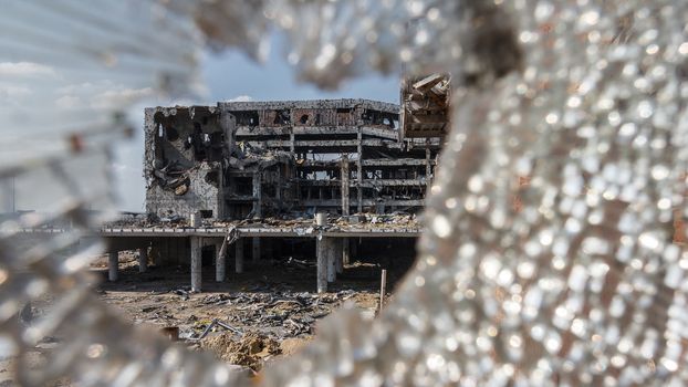 Wide Angle view of donetsk airport ruins through broken glass after massive artillery shelling