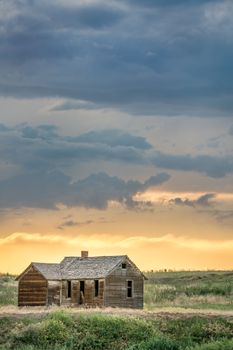 old abandoned farmhouse on a prairie, St Vrain State Park near Longmont, Colorado