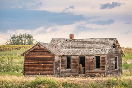 old abandoned farmhouse on a prairie, St Vrain State Park near Longmont, Colorado