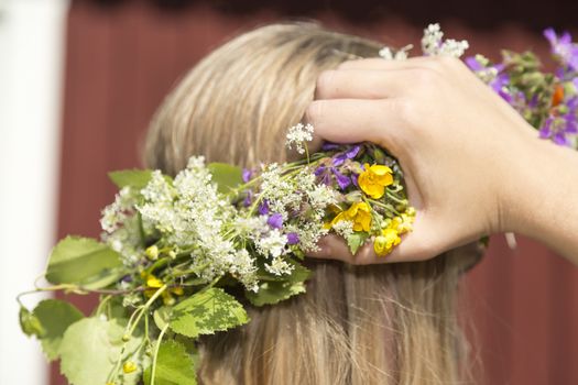 Swedish Midsummer Headgear Traditional on a female head of hair.